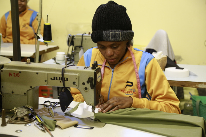 Philetrix tailor sewing a garment